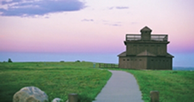 A rebuilt blockhouse above Fort Lincoln marks the uppermost reach of the Fort where General Custer and his scouts once lived.