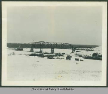 From the North Dakota State Historical Society, the first Four Bears Bridge built near the now flooded town of Elbowoods.